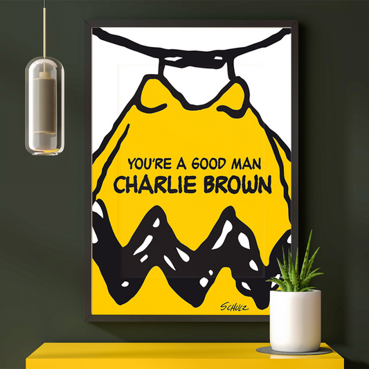 You're a Good Man, Charlie Brown rappresenta la maglietta gialla con zig-zag neri di Charlie Brown con il titolo dell'opera sopra di essa.